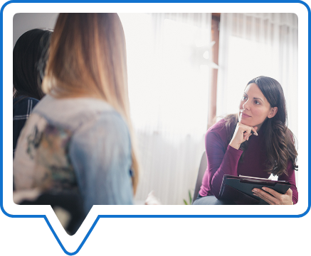 Female therapist talking with a group